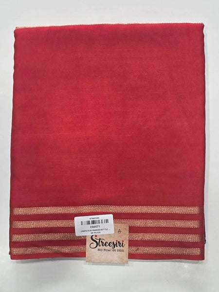 Contrast Orange Bottle Green Crepe Silk Saree